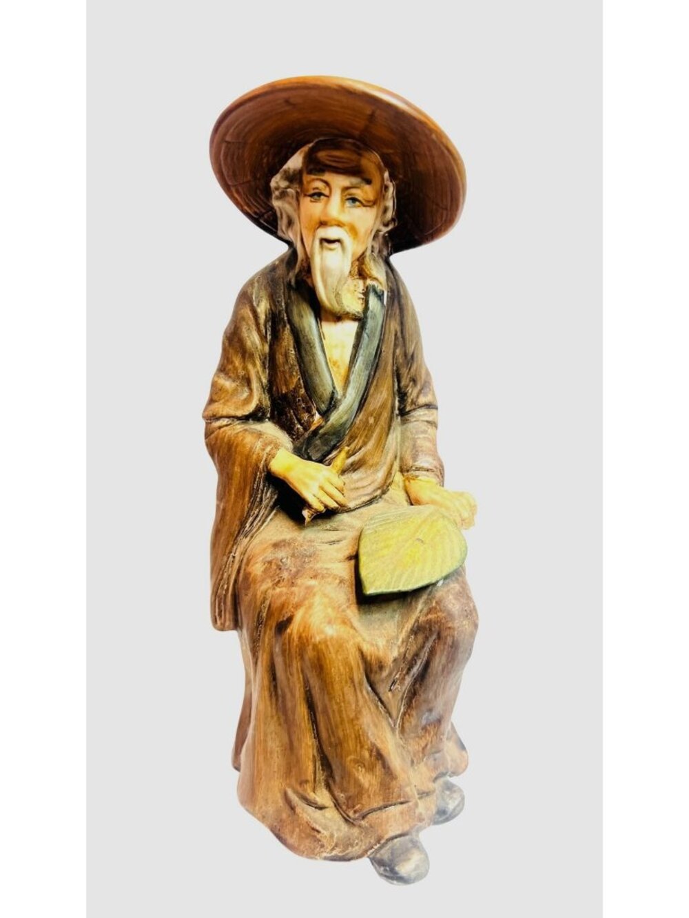 Vintage collectible figurine, old Asian wiseman holding a leaf fan, circa 1970